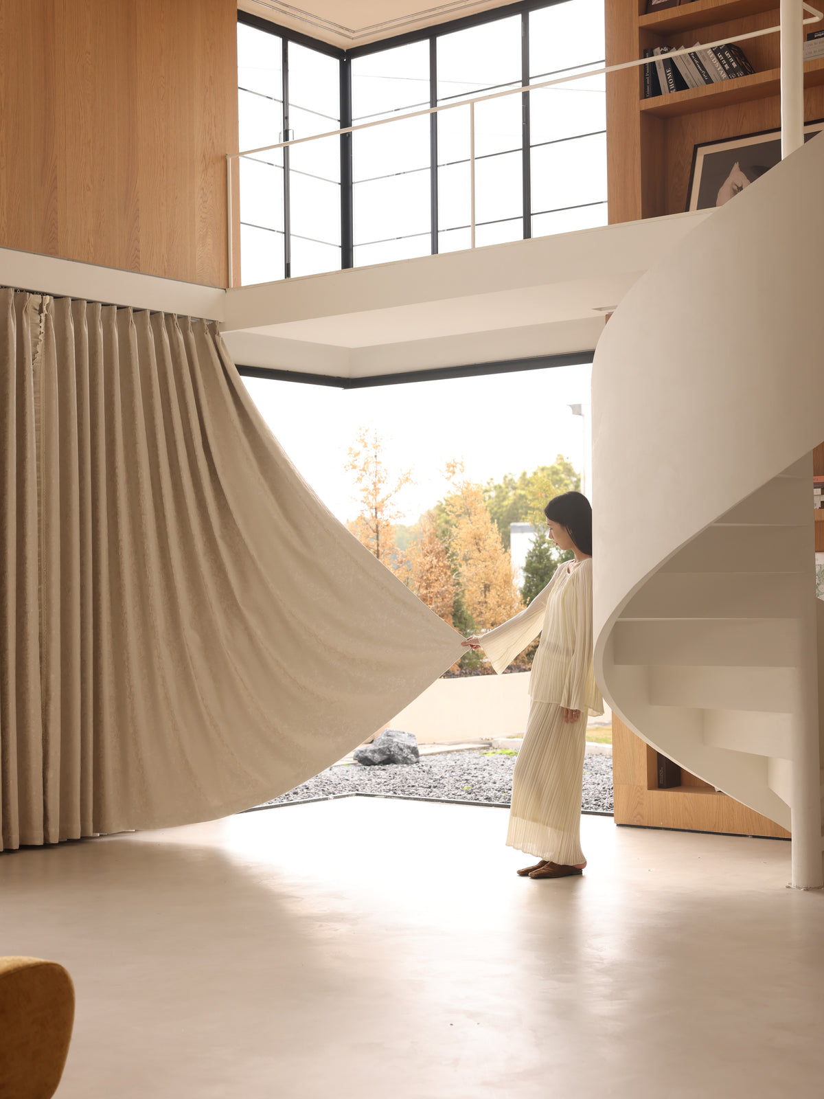 Full-length chenille blackout curtain with elegant drape in a contemporary interior