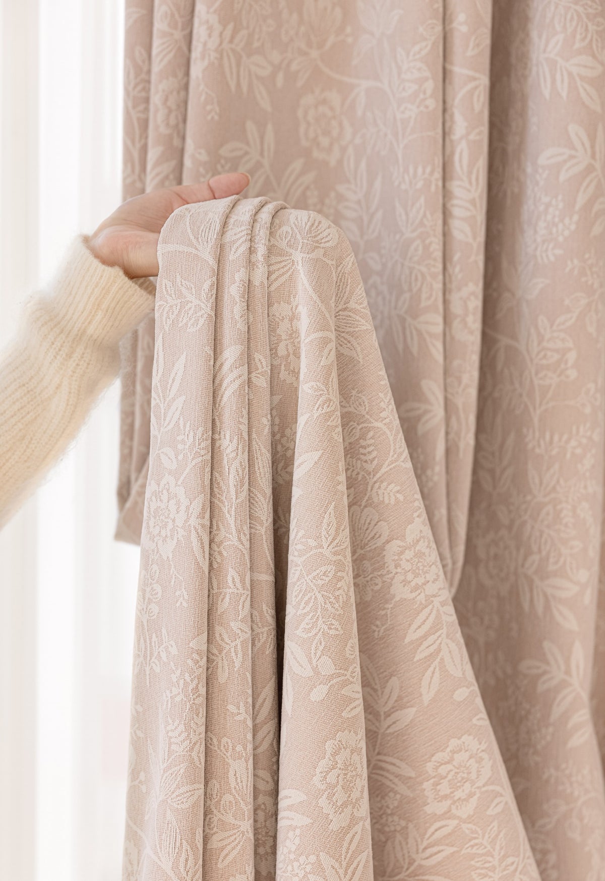 Close-up of blush pink chenille curtain fabric