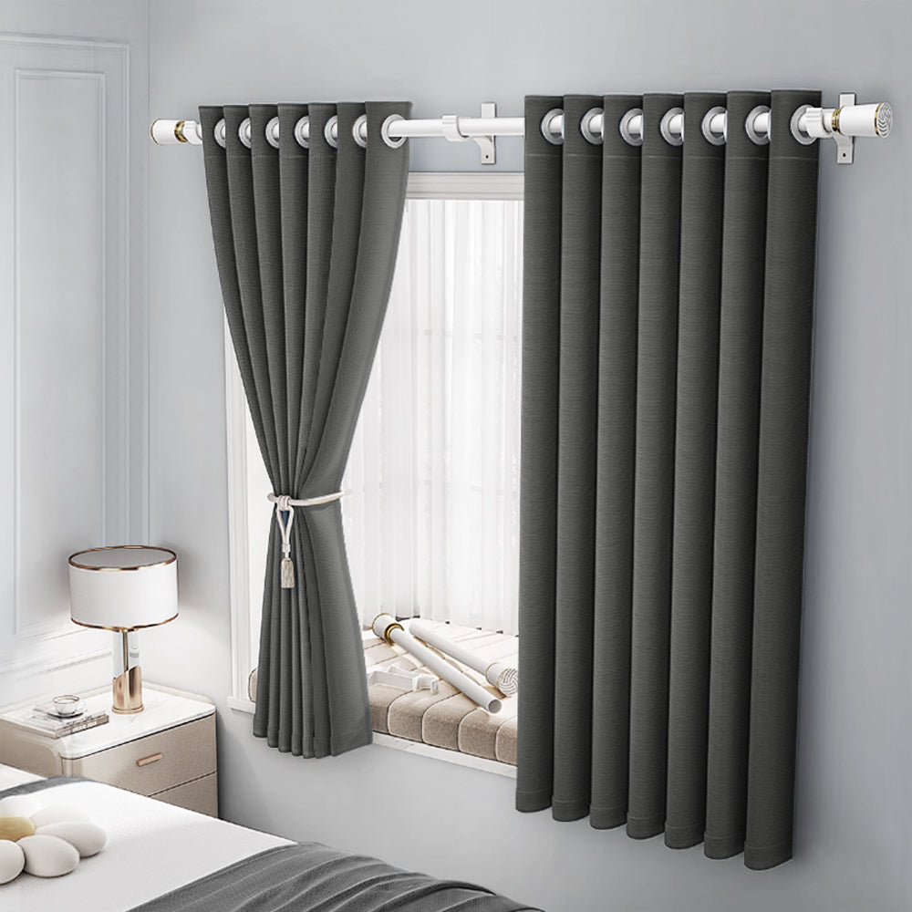 Charcoal faux linen grommet curtain installed in a modern bedroom