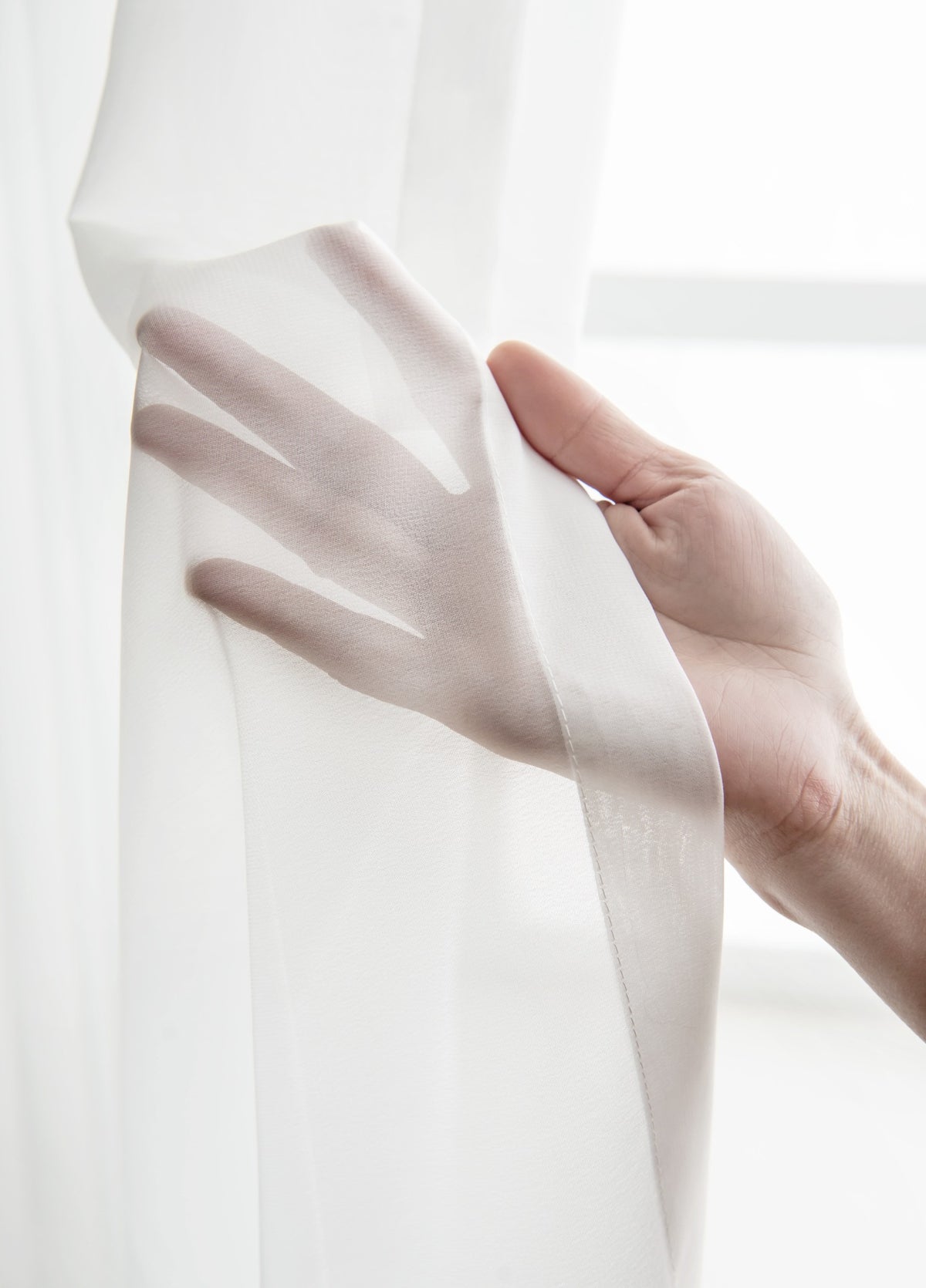 Close-up showing the fine translucent weave and finished side seam