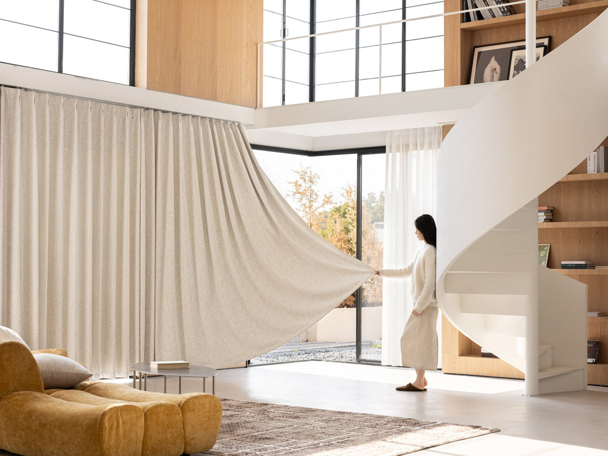 Ivory botanical chenille blackout curtain in a bright modern interior