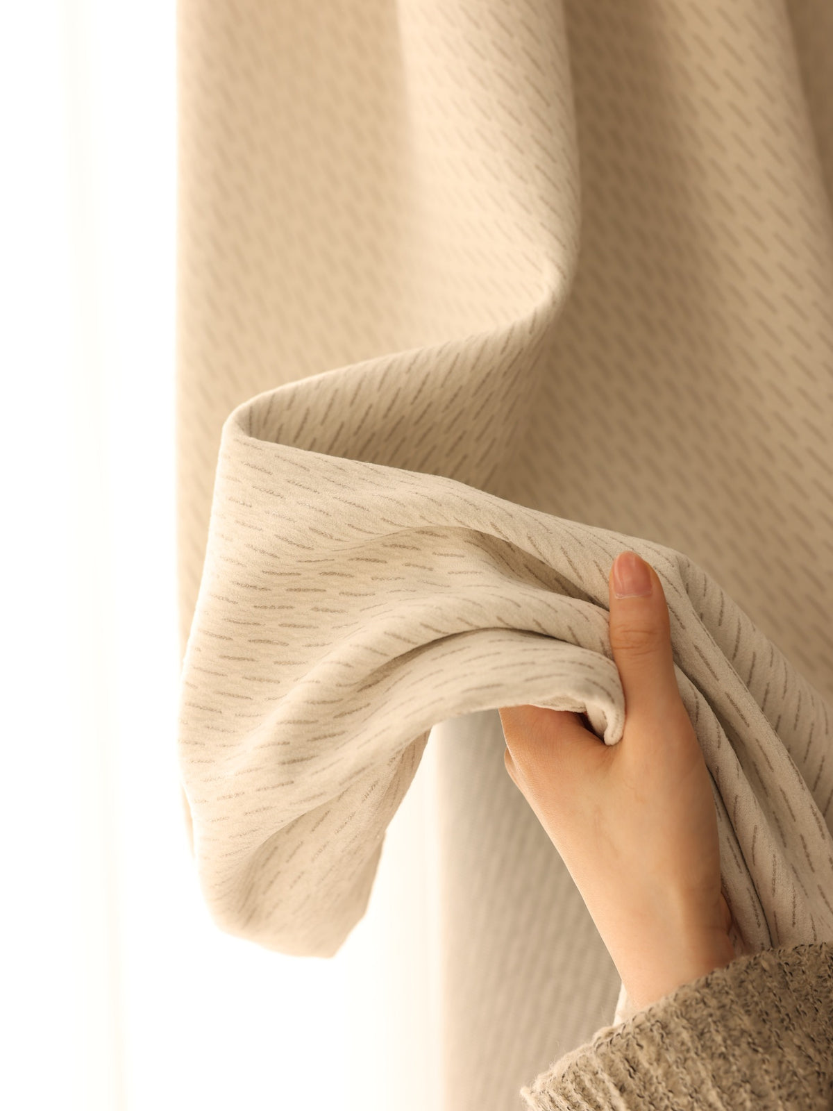Close-up showing thick soft chenille curtain texture and flexibility