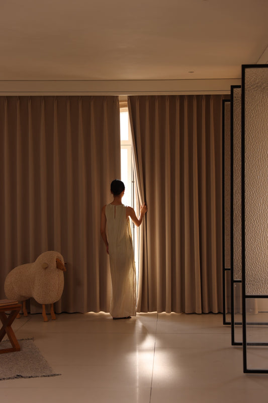 Warm beige chenille blackout curtains closed for room-darkening privacy
