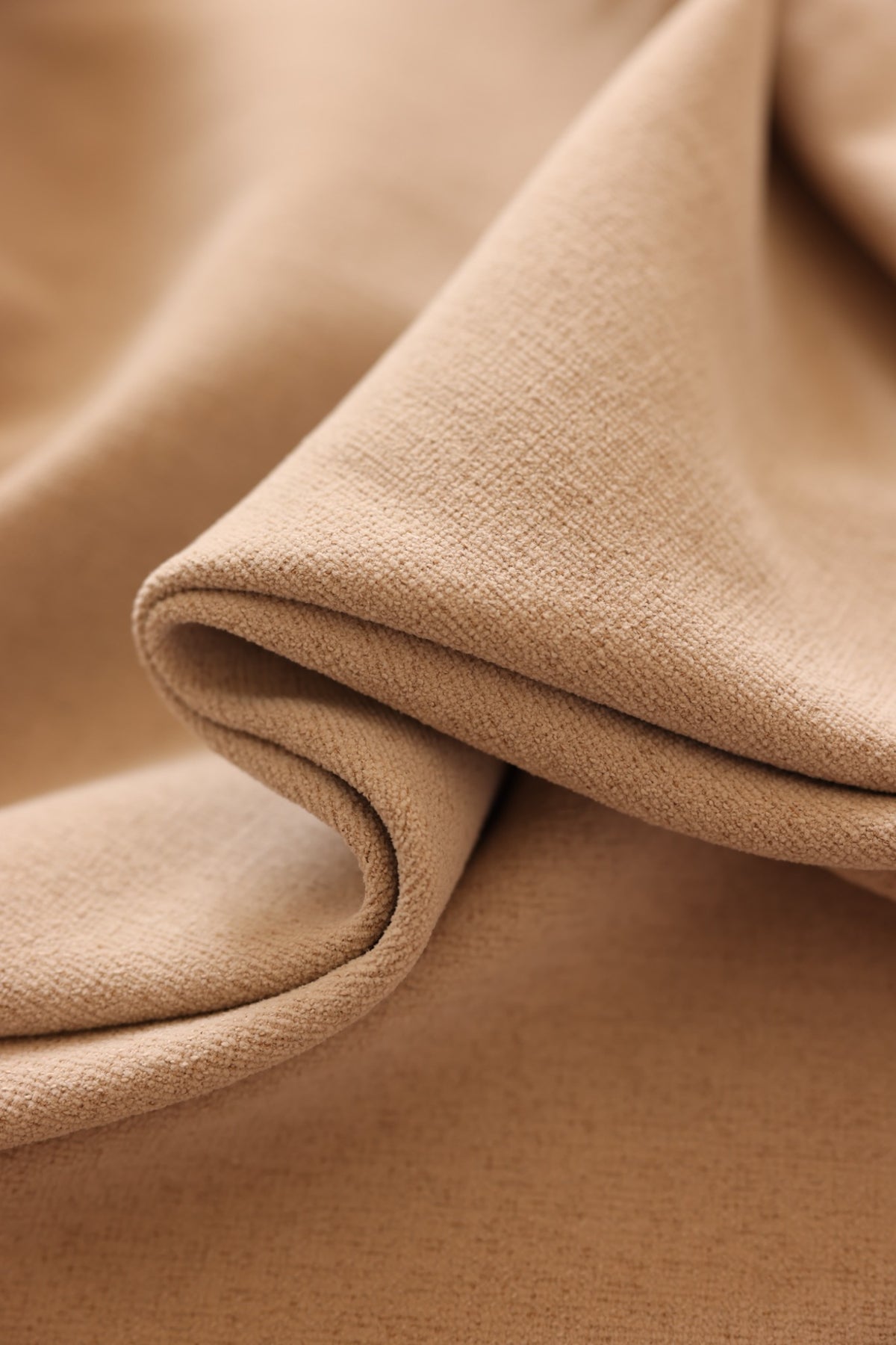 Close-up of finely textured warm beige Yunjin chenille fabric